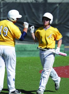 Alhambra’s Matt Beck celebrates scoring the tying run on April 15, 2016. Brett Sterrer (19) drove in the winning run in the next at bat. (MARK FIERNER / Martinez Tribune)