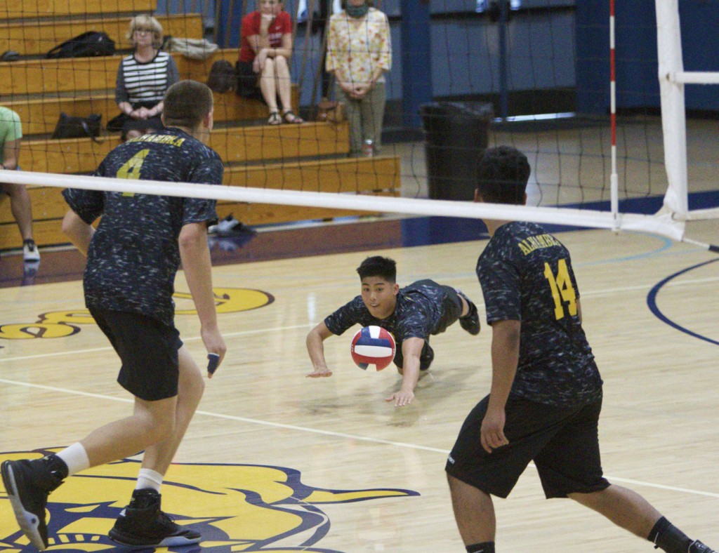 Alhambra setter Savion Prieto fully extends to dig out a shot in the Bulldogs’ 3-1 win over Campolindo in the semi-final of the NCS Division II Playoffs on May 17, 2016. (MARK FIERNER / Martinez Tribune)