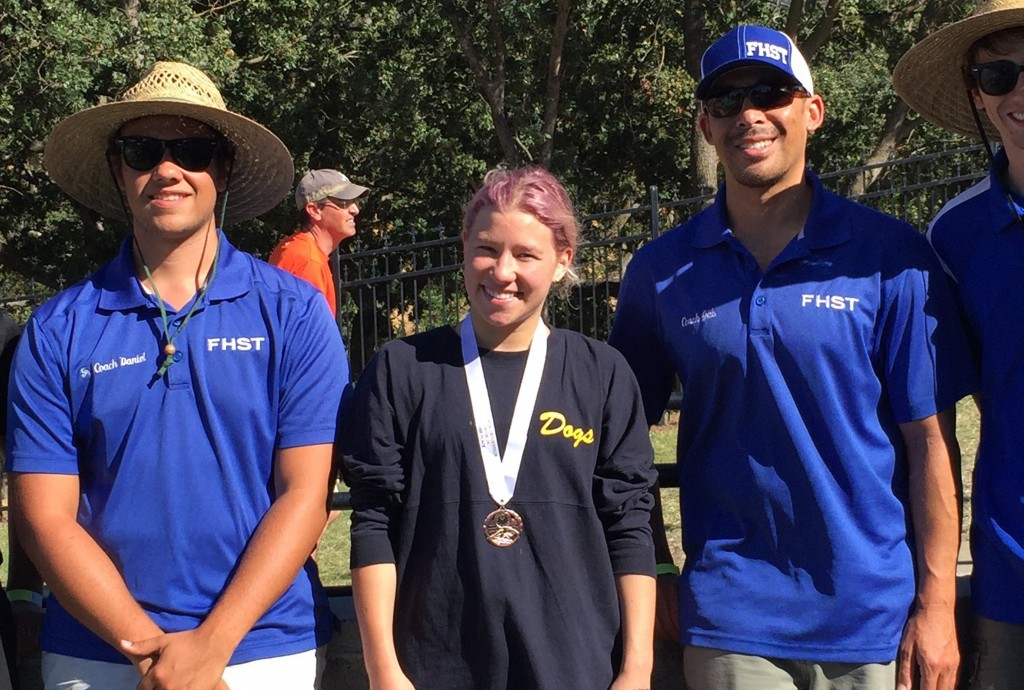 Julia Paulazzo (center) with her coaches Daniel and Gab. (COURTESY / On File)