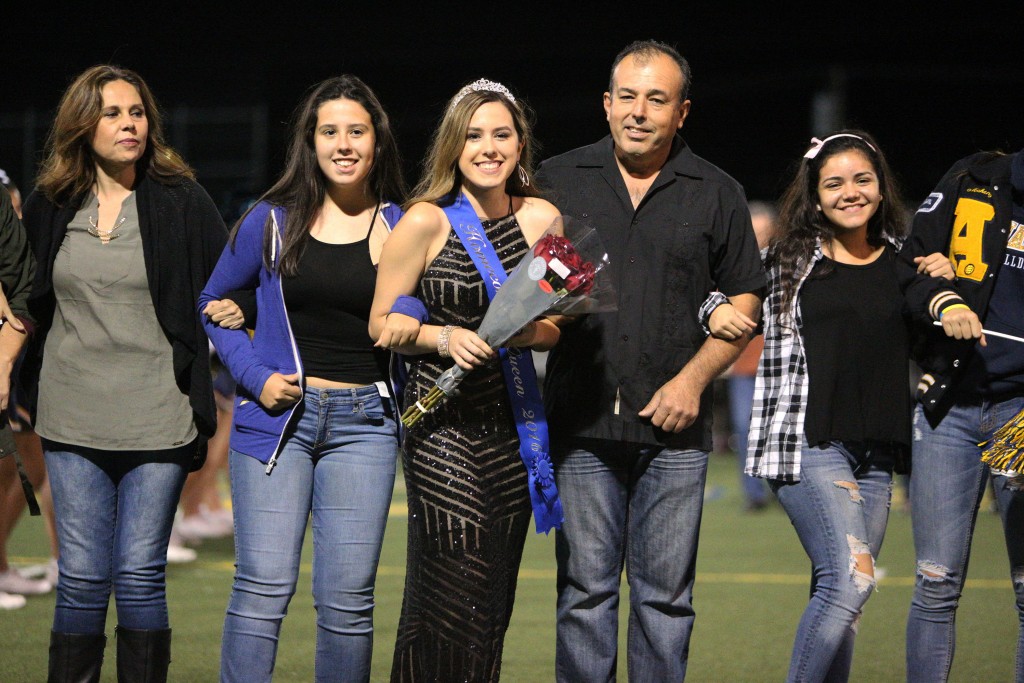 Alhambra High School’s 2016 Homecoming Queen, Alexia Lopez, walks with her family during halftime at the football game at Knowles Field in Martinez, Friday, Oct. 21, 2016. (MARK FIERNER / Martinez Tribune)